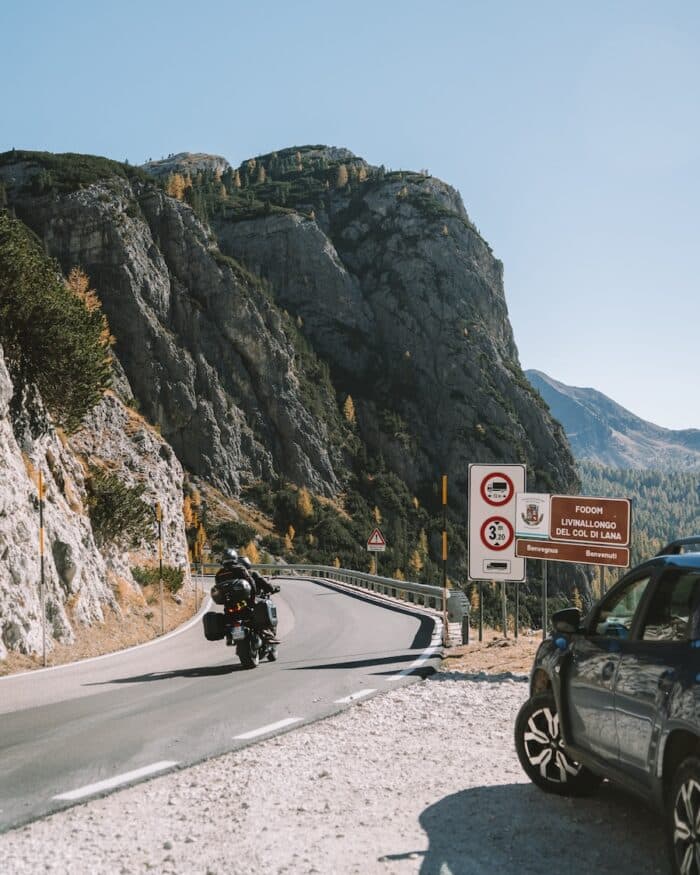 Motorcyclist taking a curve Motorcyclist taking a curve in the Dolomites