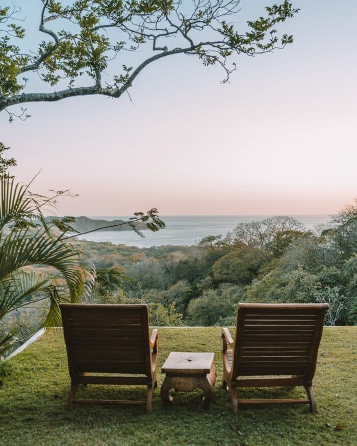 Two sun chairs Two sun chairs looking out to a panoramic view of Nosara at sunset