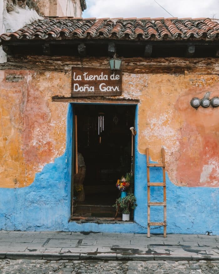 La Tienda Doลa Gavi Shop facade of La Tienda Doลa Gavi painted in bue and orange