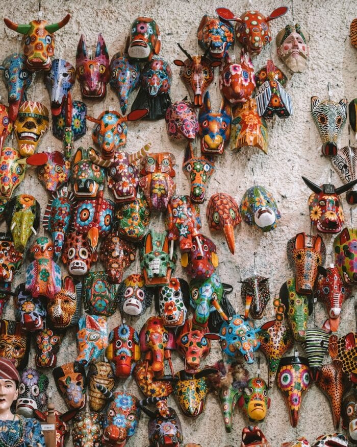 masks lining a wall at Nim P'ot Colorful masks lining a wall at Nim P'ot