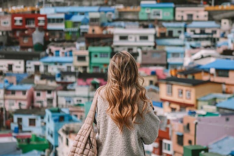 Michelle Halpern standing in front of Gamcheon Culture village looking at the colorful houses
