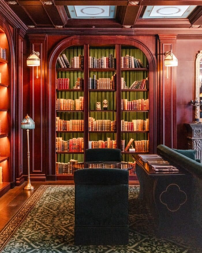 Parisian style bookcase Parisian style bookcase in deep warm tones in an opulent room featuring colorful walls