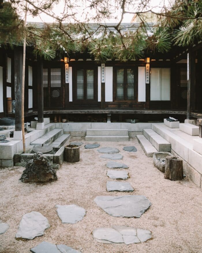 Rakkojae Seoul Sandy courtyard inside Rakkojae Seoul which is a traditional style hanok with a stone path