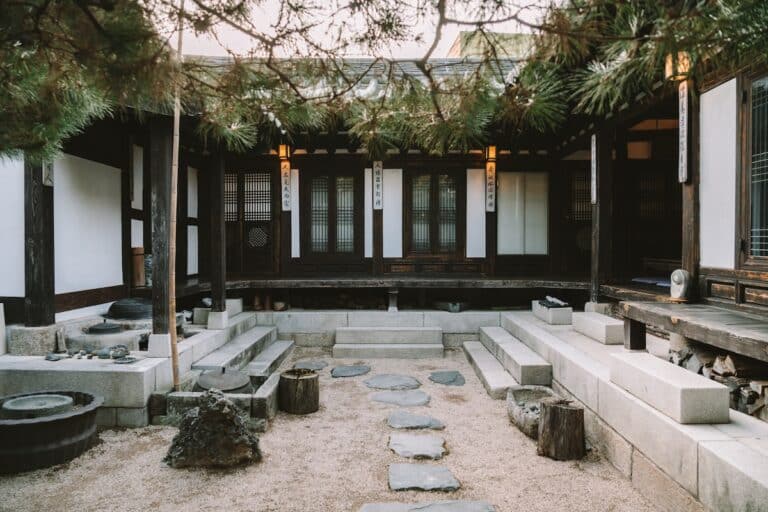 Sandy courtyard inside Rakkojae Seoul which is a traditional style hanok with a stone path