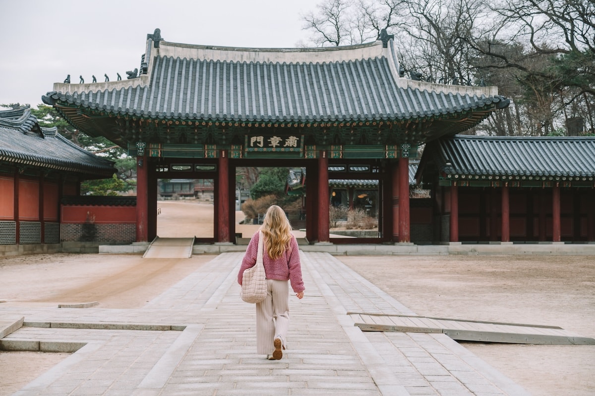 Korean palace Michelle Halpern strolling on a path towards one of Seoul's many traditional palaces