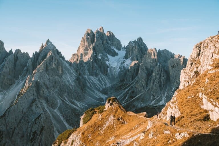 Iconic shot at Cadini di Misurina of tiny hiker up on the trail