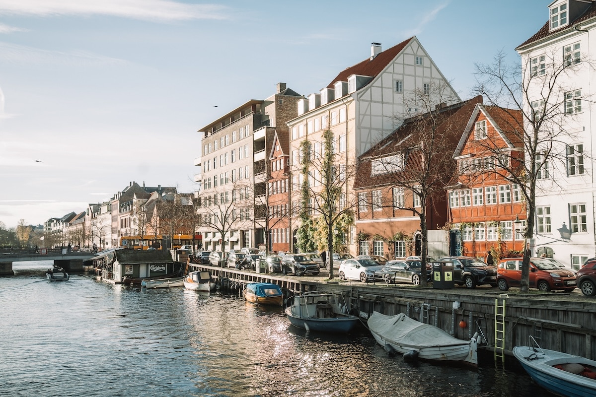 Canal in Christianshavn Canal in Christianshavn lined by boats and charming Danish houses