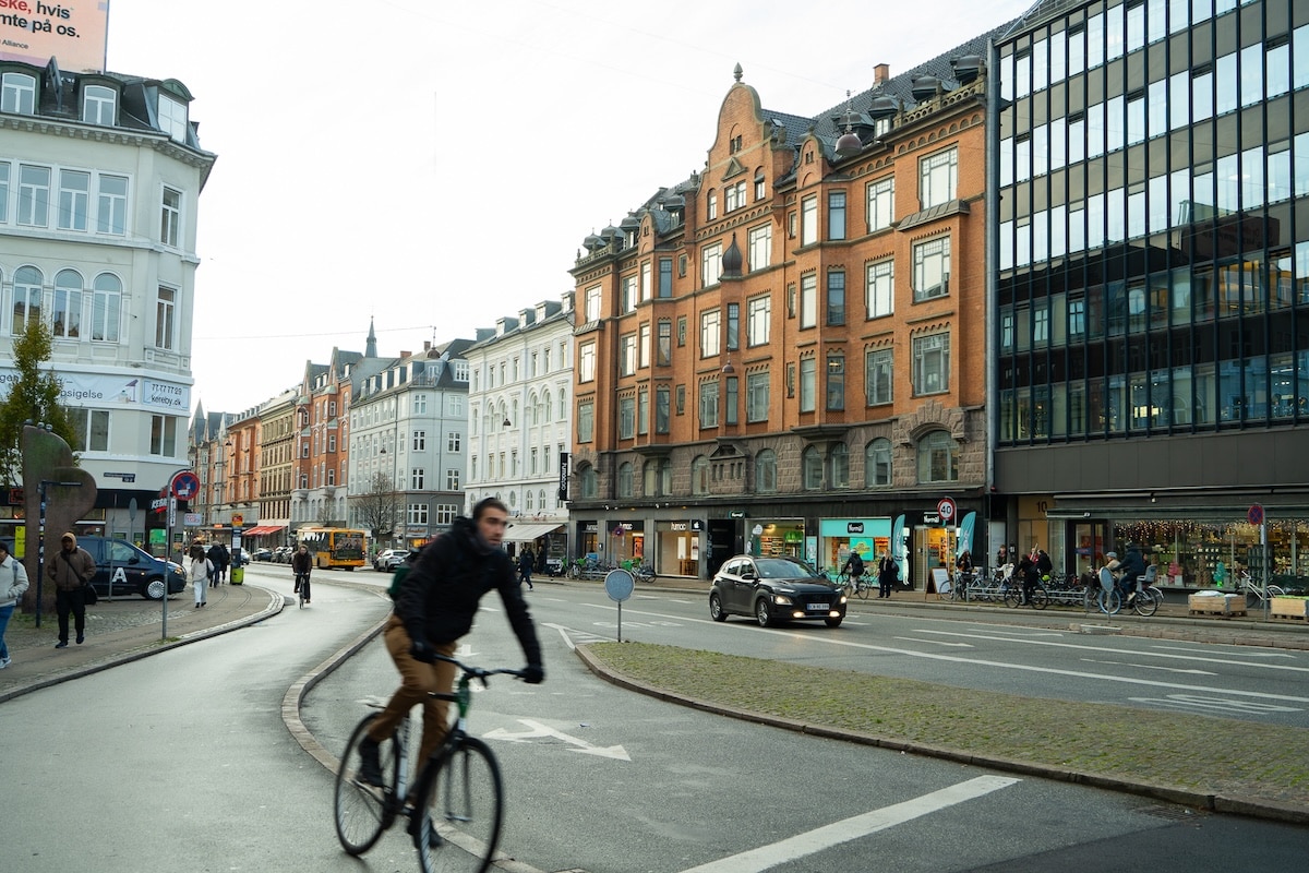 bike Vesterbro neighborhood Biker riding through Vesterbro neighborhood in Copenhagen
