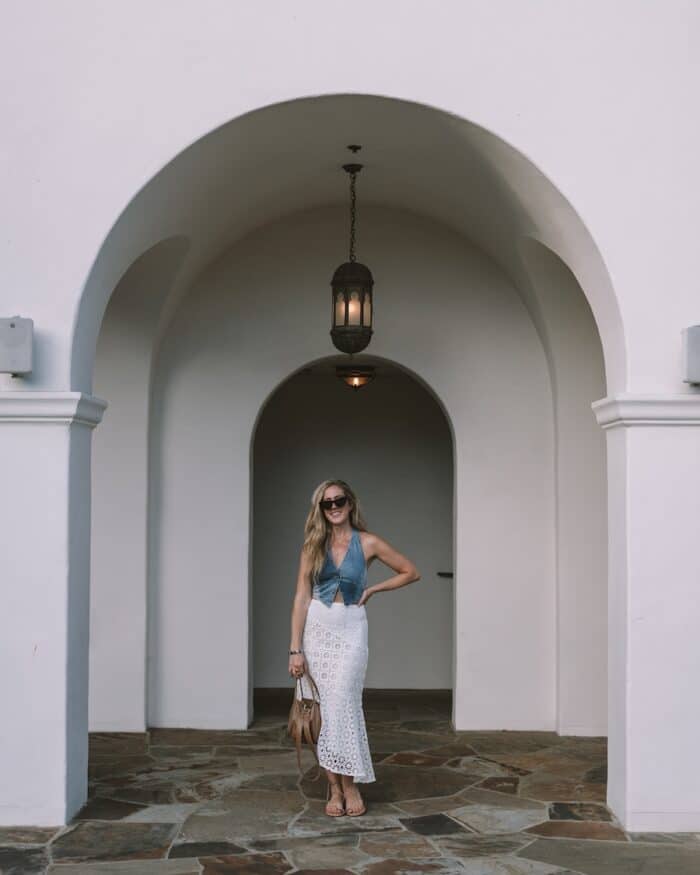 white spanish style archway Michelle Halpern standing in a white spanish style archway