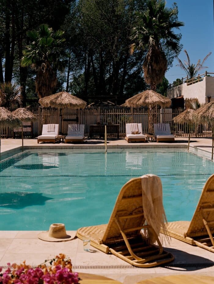 Pool area at Jacumba Hot Springs Hotel Pool area at Jacumba Hot Springs Hotel with umbrella with thatched roofs