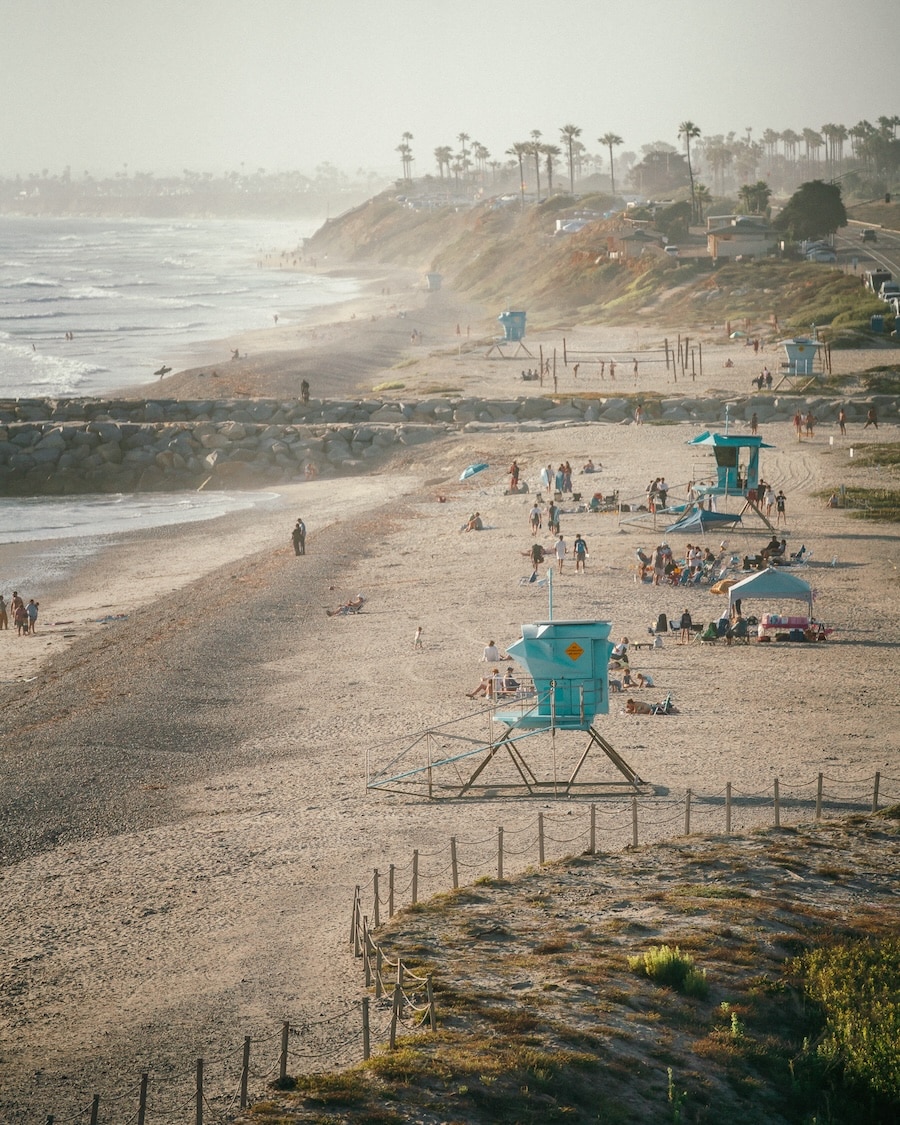 South Ponto Beach Turquoise lifeguard towers and people out and about on South Ponto Beach | Things to Do in Encinitas