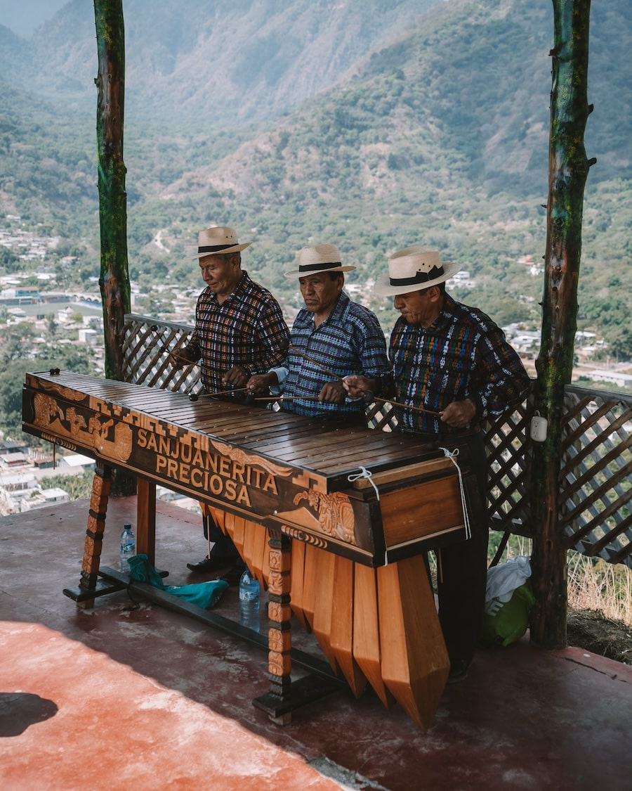Guatemalan men playing instruments Guatemalan men playing instruments at the top of the Mirador Kaqasiiwaan