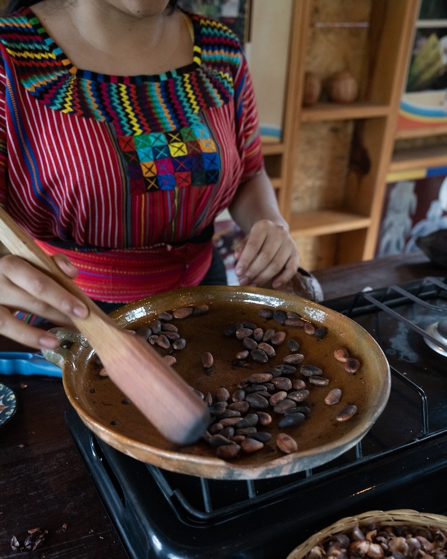 stirring cocoa beans Local Guatemalan woman stirring cocoa beans