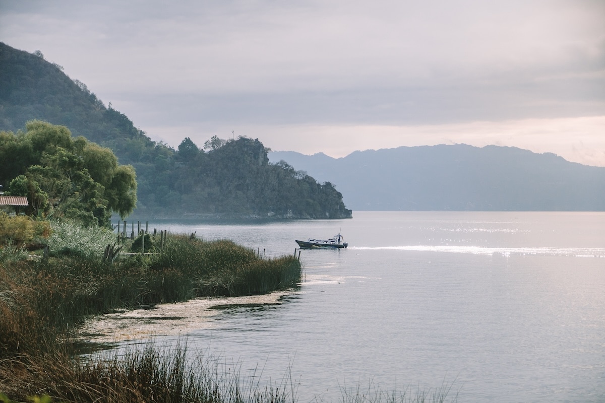 Early morning Lake Atitlan Early morning on Lake Atitlan with calm water and a lancha in the distance