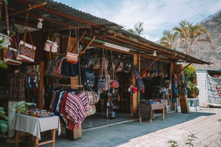 Artisan goods and textiles hanging in a market in Panajachel, Guatemala
