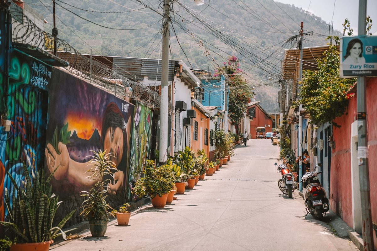 Colorful street in Panajachel Colorful street in Panajachel lined with potted plants and murals