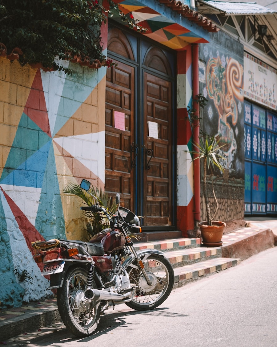 colorful painted building Motorcycle in front of a colorful painted building