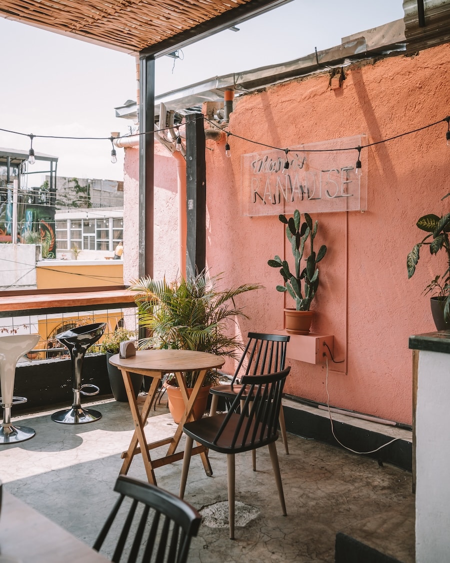 Little Spoon Rooftop terrace at Little Spoon featuring a pink wall with a neon sign