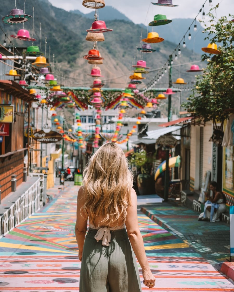 colorful street in San Juan La Laguna Michelle Halpern walking along a colorful street in San Juan La Laguna filled with colorful hats