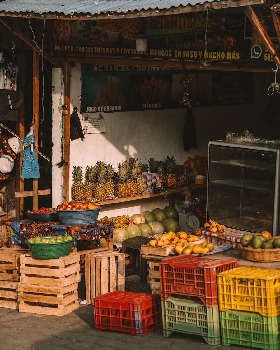 produce at an outdoor market Golden glow casting light on produce at an outdoor market