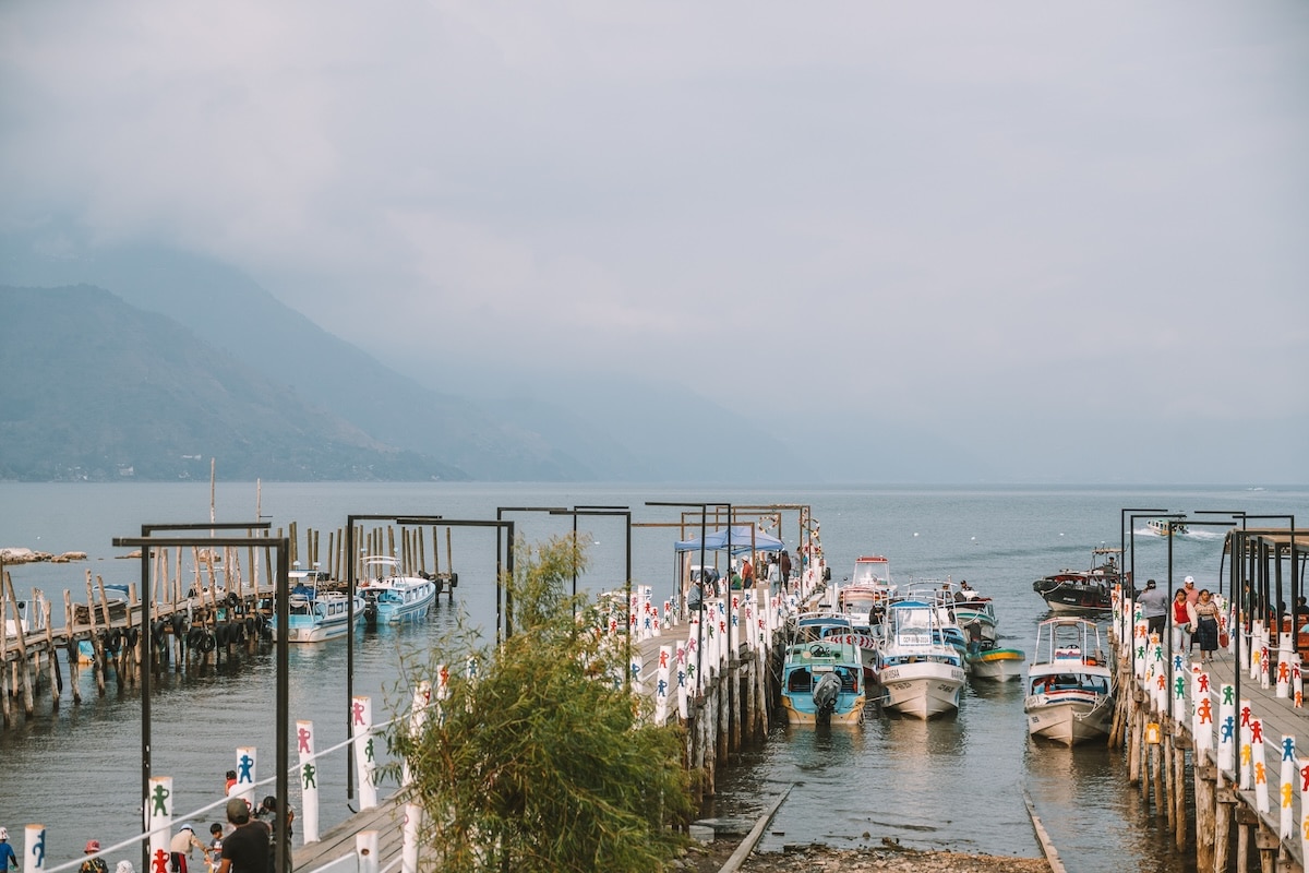 lake and mountains The docks and lanchas in San Juan La Laguna with a misty backdrop of the lake and mountains