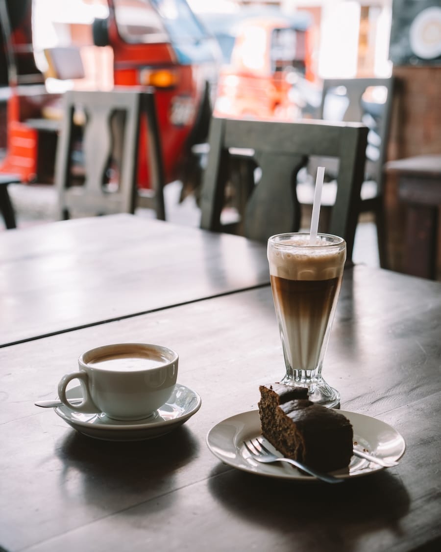 coffees and a slice of cake Close up shot of coffees and a slice of cake