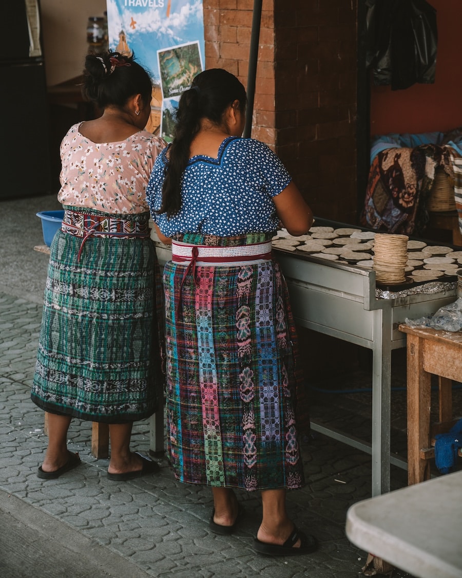 handmaking tortillas Local Maya women handmaking tortillas while wearing traditional dress