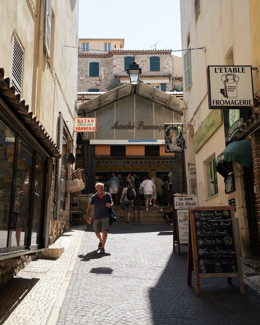 entrance of the Marché Provençal in Antibes Man walking away from the entrance of the Marché Provençal in Antibes