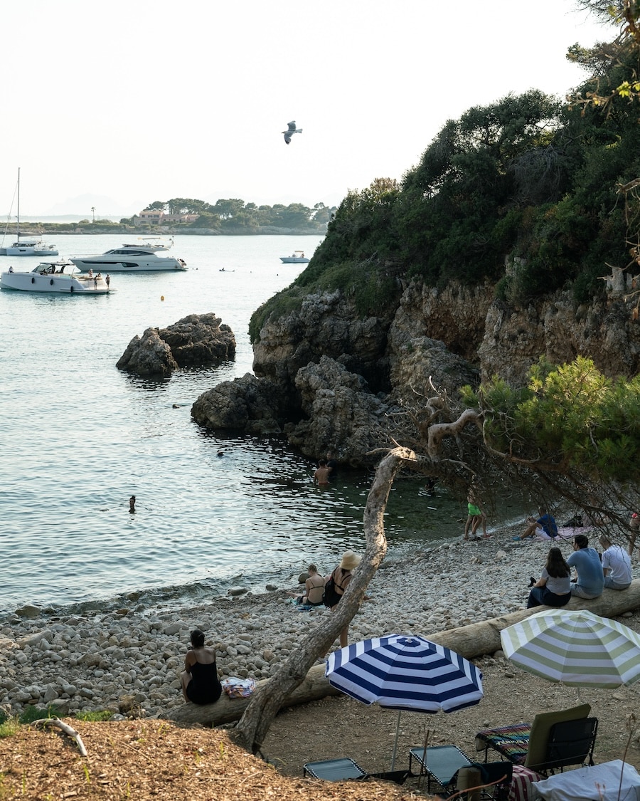 striped umbrellas Two striped umbrellas set up at Bay of Billionaires in Antibes