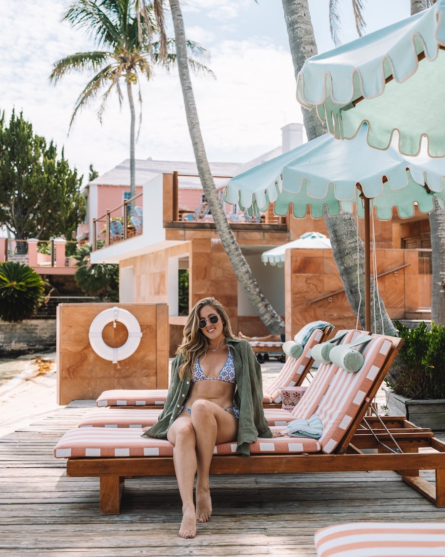 olive green linen button-down Michelle Halpern wearing an olive green linen button-down on a hotel beach lounger | What To Pack For A Beach Vacation